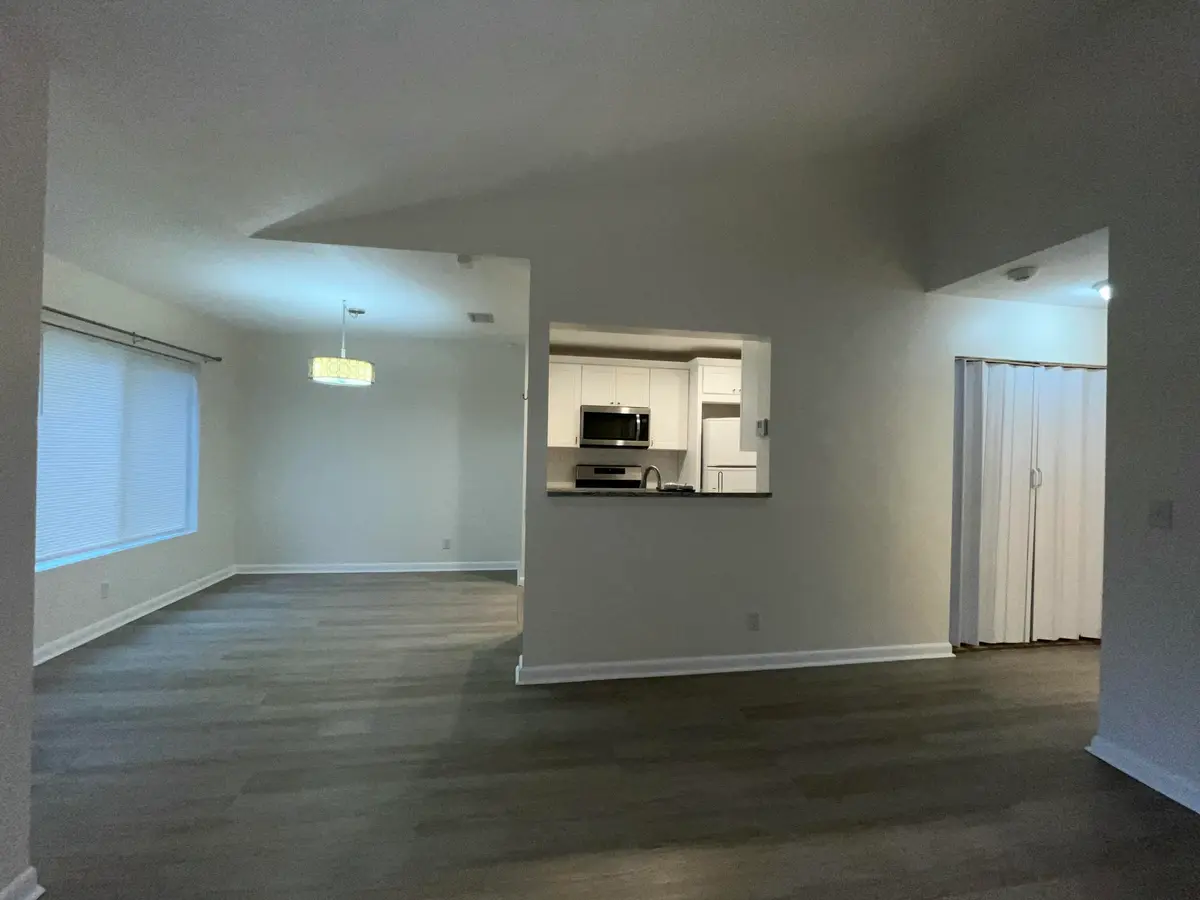 Living room into dining and kitchen at 815 W BOYNTON BEACH Boulevard 11-203, Boynton Beach
