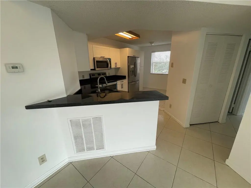 Photo 5 at 9033 WILES Road 302, Coral Springs