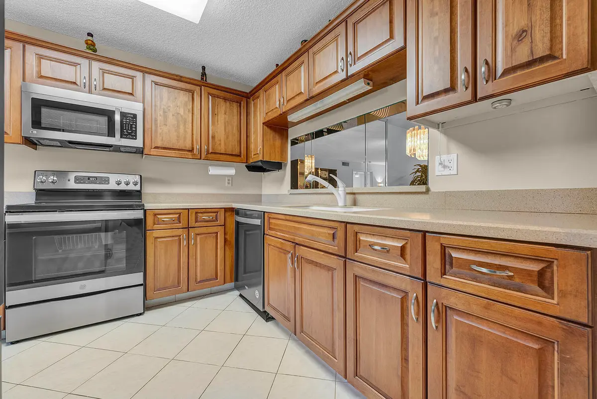 Kitchen with pass through at 15074 WITNEY Road 205, Delray Beach