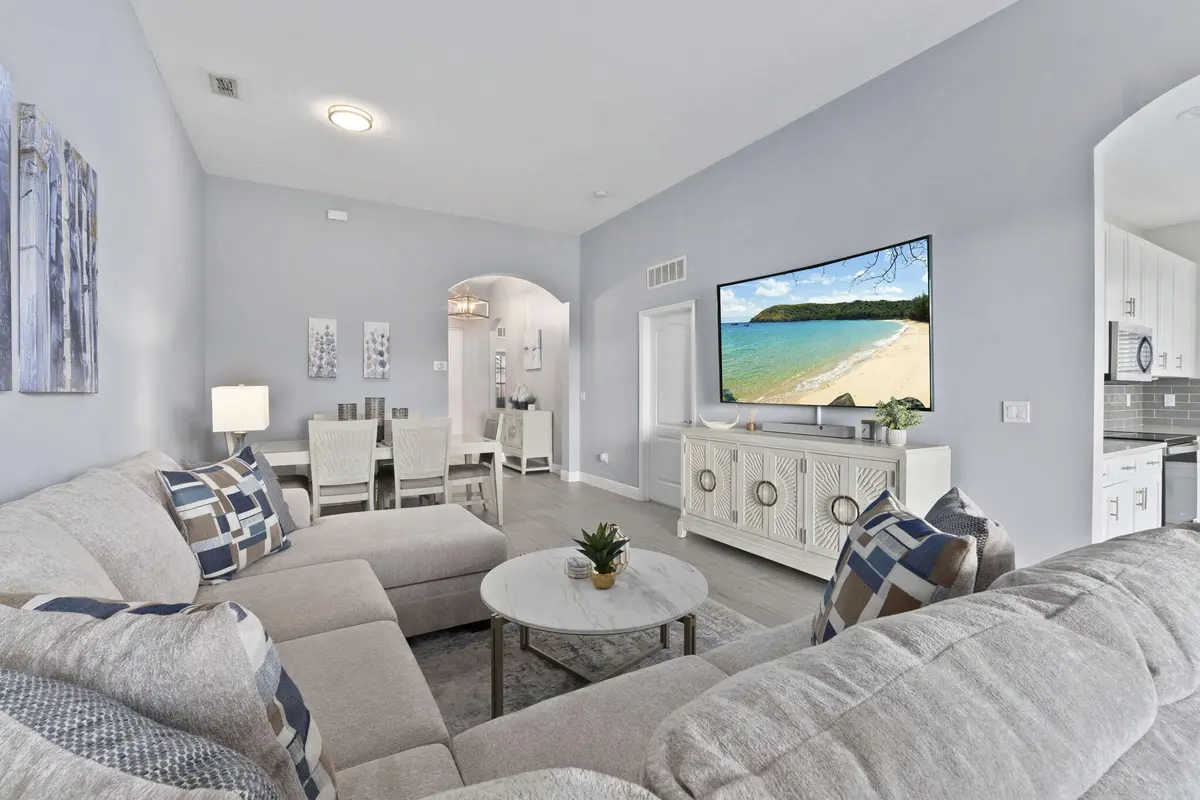 Living room and dining room at 10971 SW DUNHILL Court, Port St. Lucie