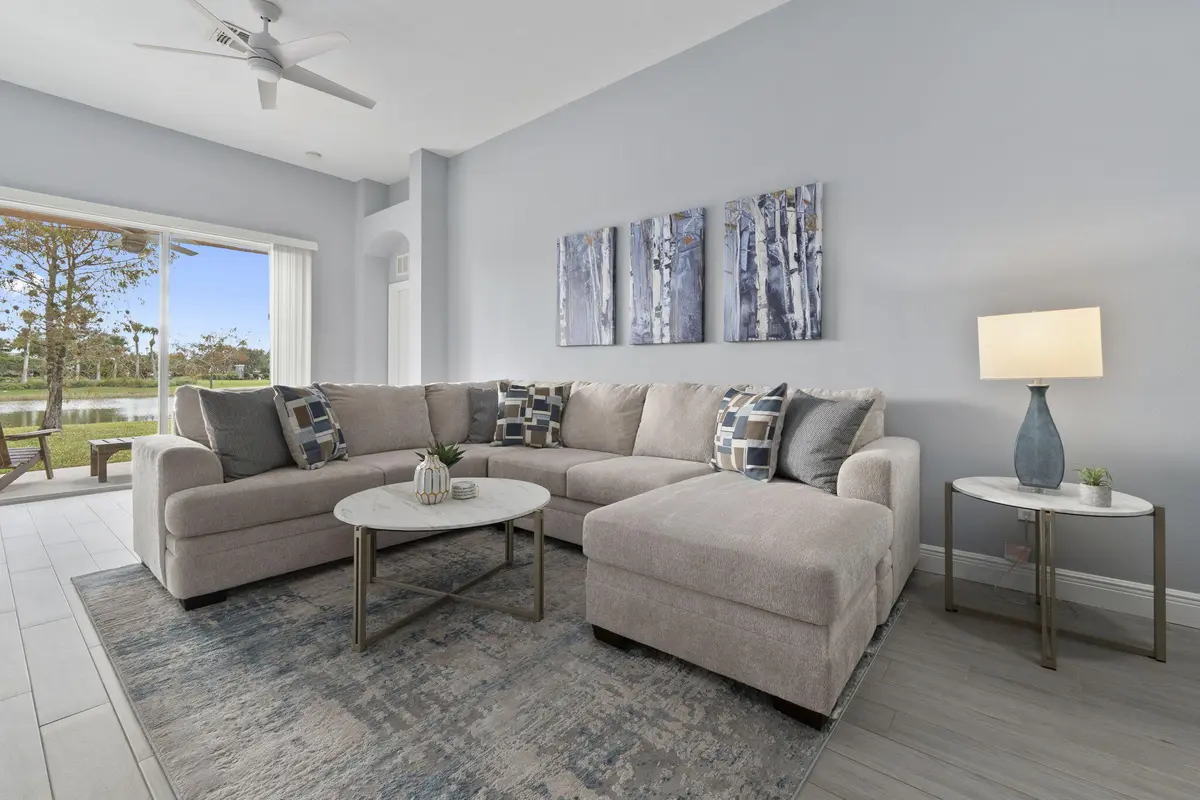 Living room with view to lanai at 10971 SW DUNHILL Court, Port St. Lucie