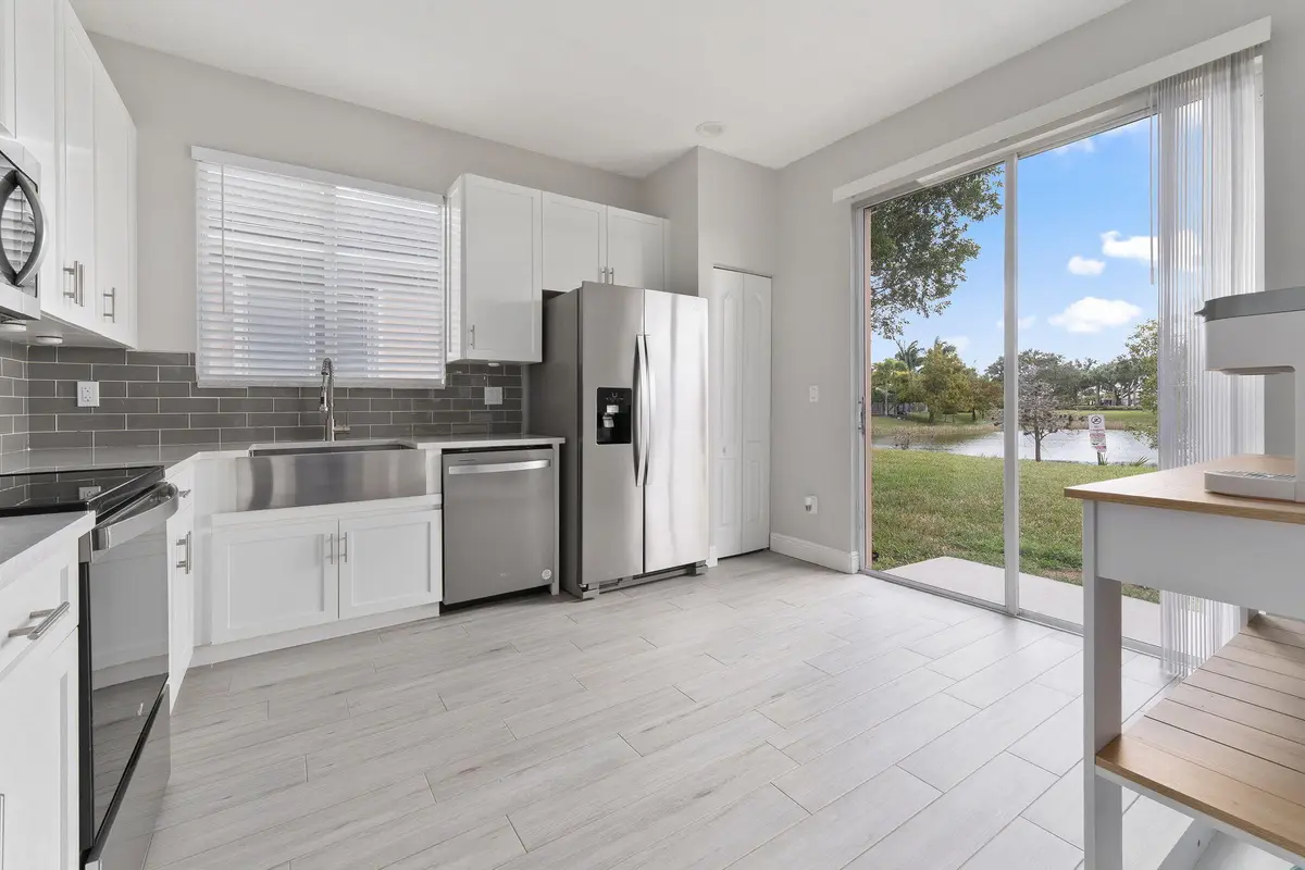 Kitchen with farm sink at 10971 SW DUNHILL Court, Port St. Lucie
