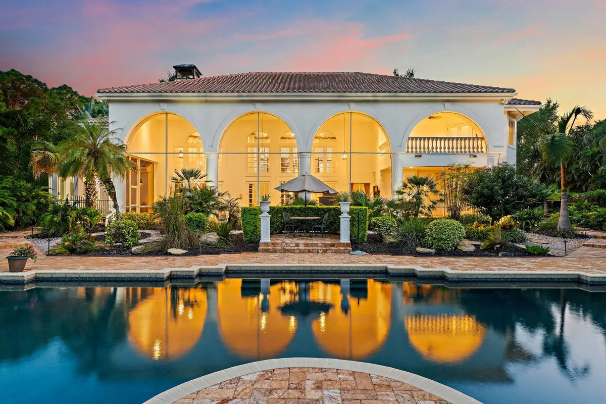 Rear Estate View at Twilight at 2584 SE Ranch Acres Circle, Jupiter