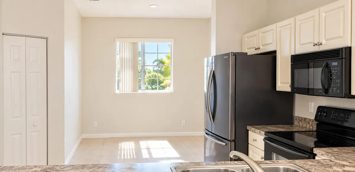 Dining area - AI Enhanced at 1977 MARSH HARBOR Drive 402, Riviera Beach