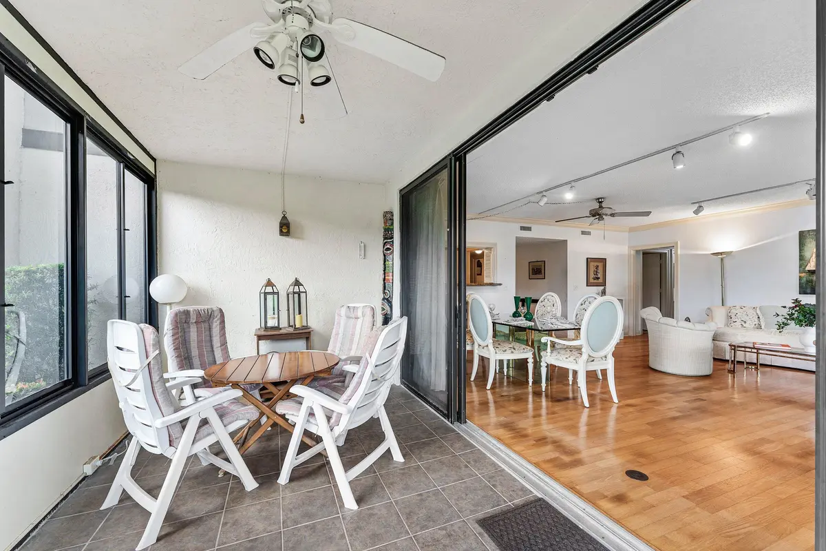 Enclosed porch and living room at 13244 Polo Club Road C107, Wellington