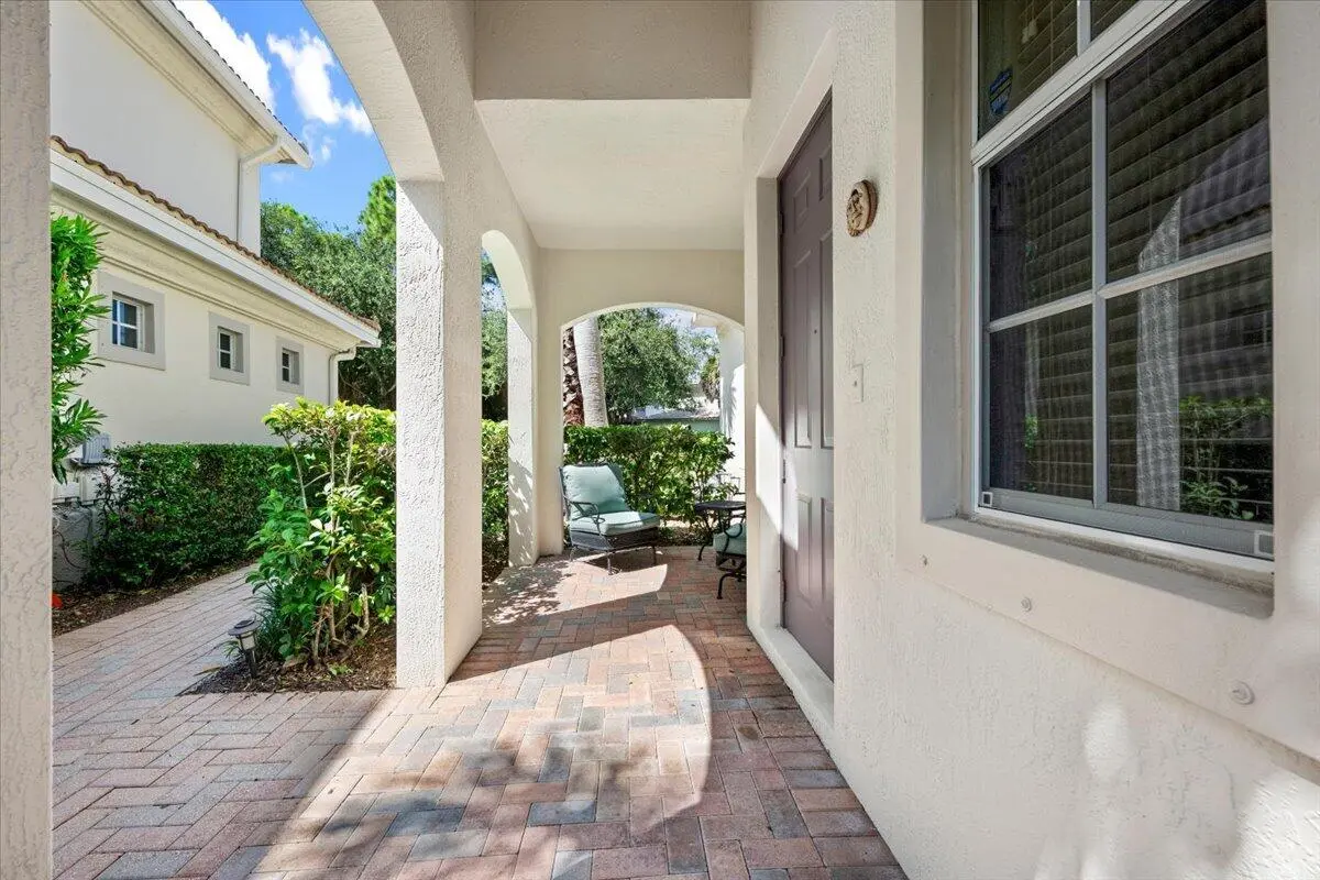 Inviting Porch Entry at 209 Evergrene Parkway, Palm Beach Gardens
