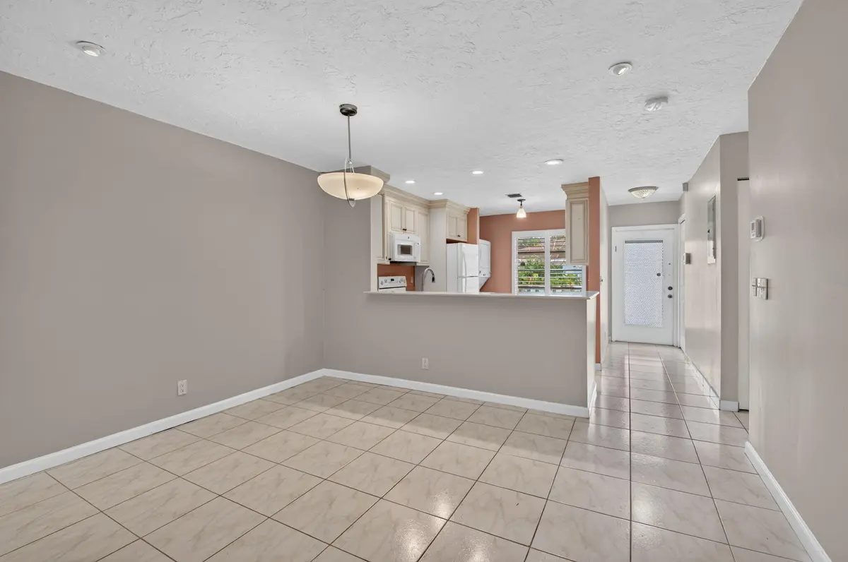 Living room and entry hall at 6789 MOONLIT Drive, Delray Beach