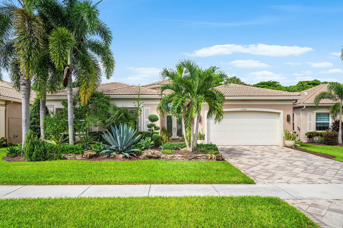 Lushly Landscaped Exterior at 9746 Dovetree Isle Drive, Boynton Beach