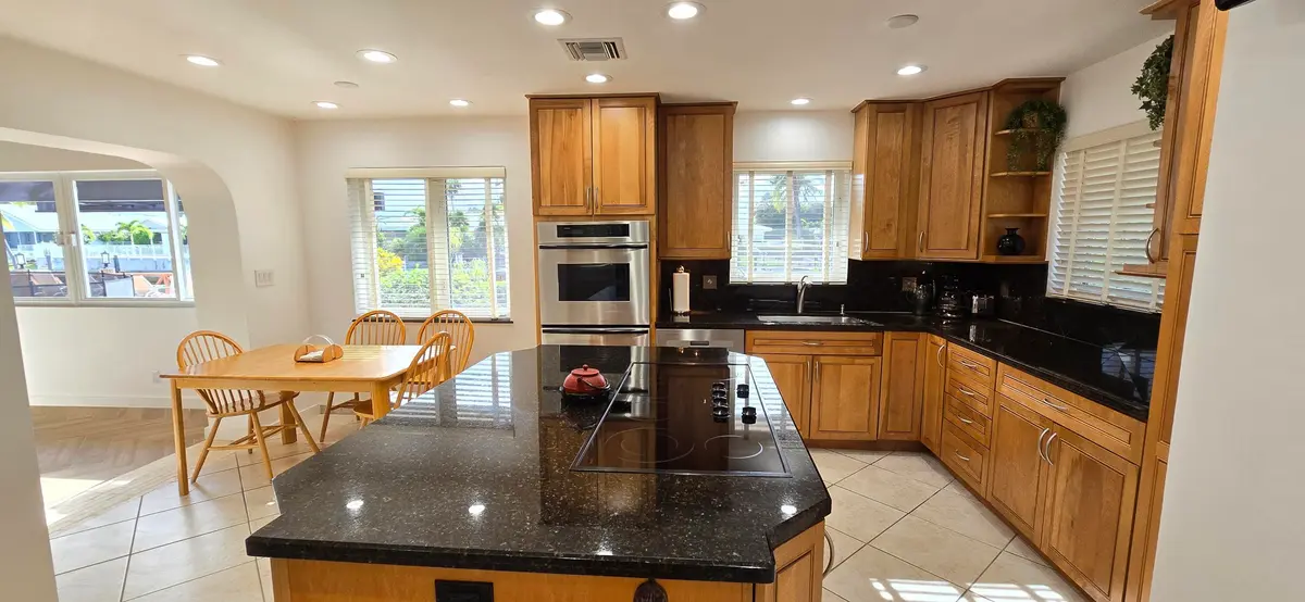 Water view kitchen & island at 4011 NE 27th Terrace, Lighthouse Point