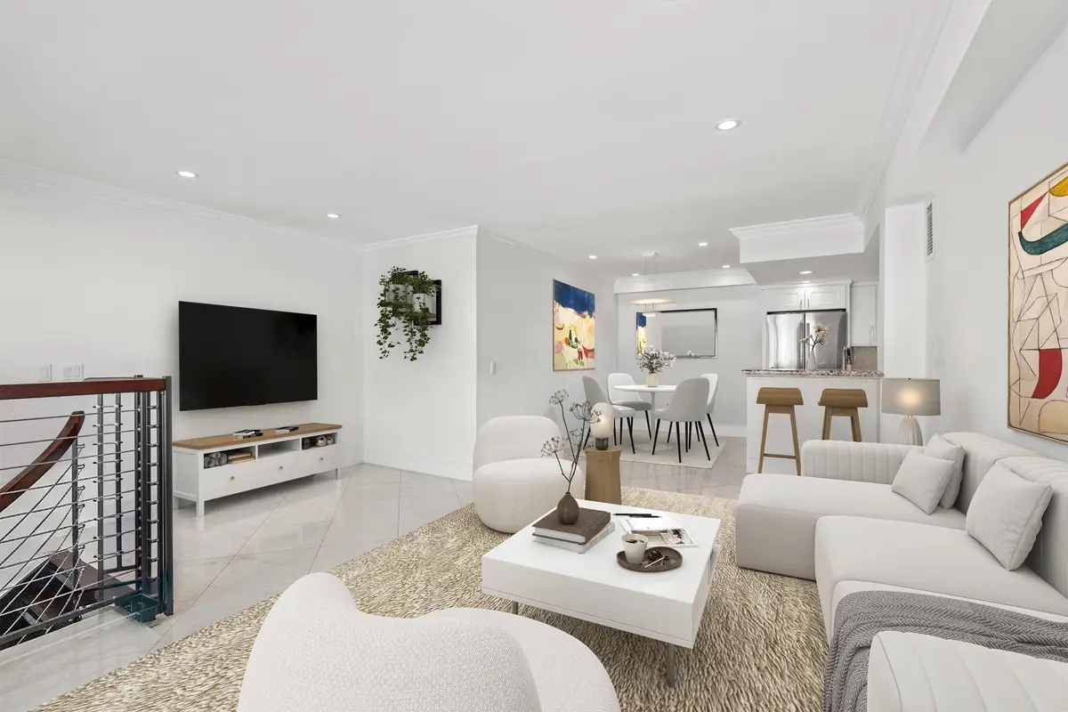 LIVING_TO_KITCHEN_VIRTUALLY STAGED at 350 S OCEAN Boulevard 204, Palm Beach