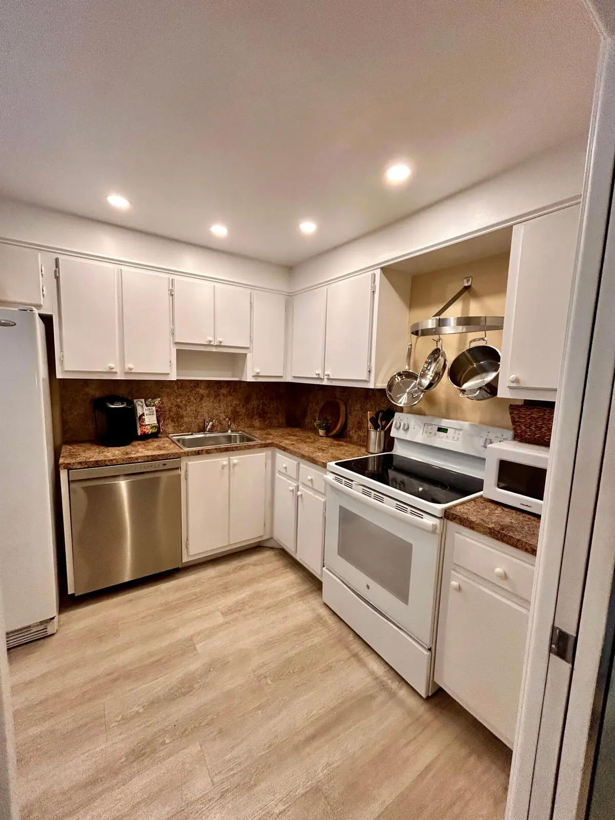 Kitchen with high hat lighting at 3850 OAKS CLUBHOUSE Drive 305, Pompano Beach
