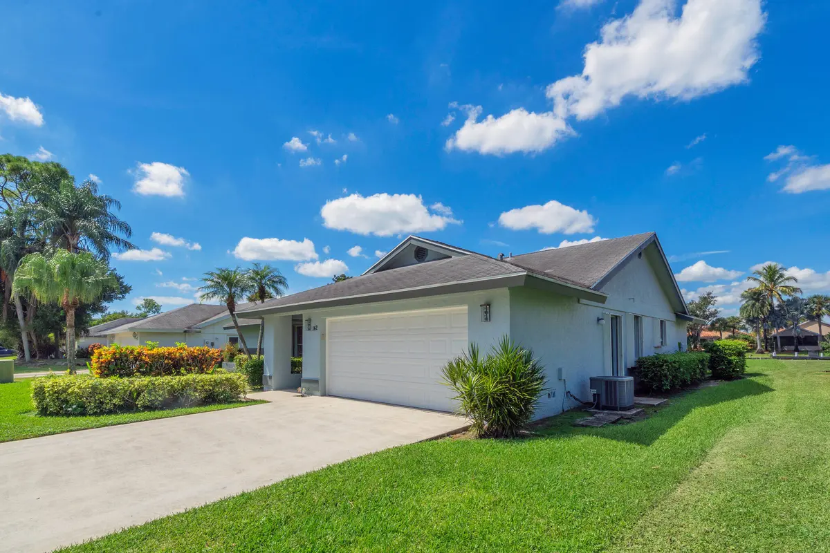 1 Exterior Front (1) at 142 PARKWOOD Drive, Royal Palm Beach