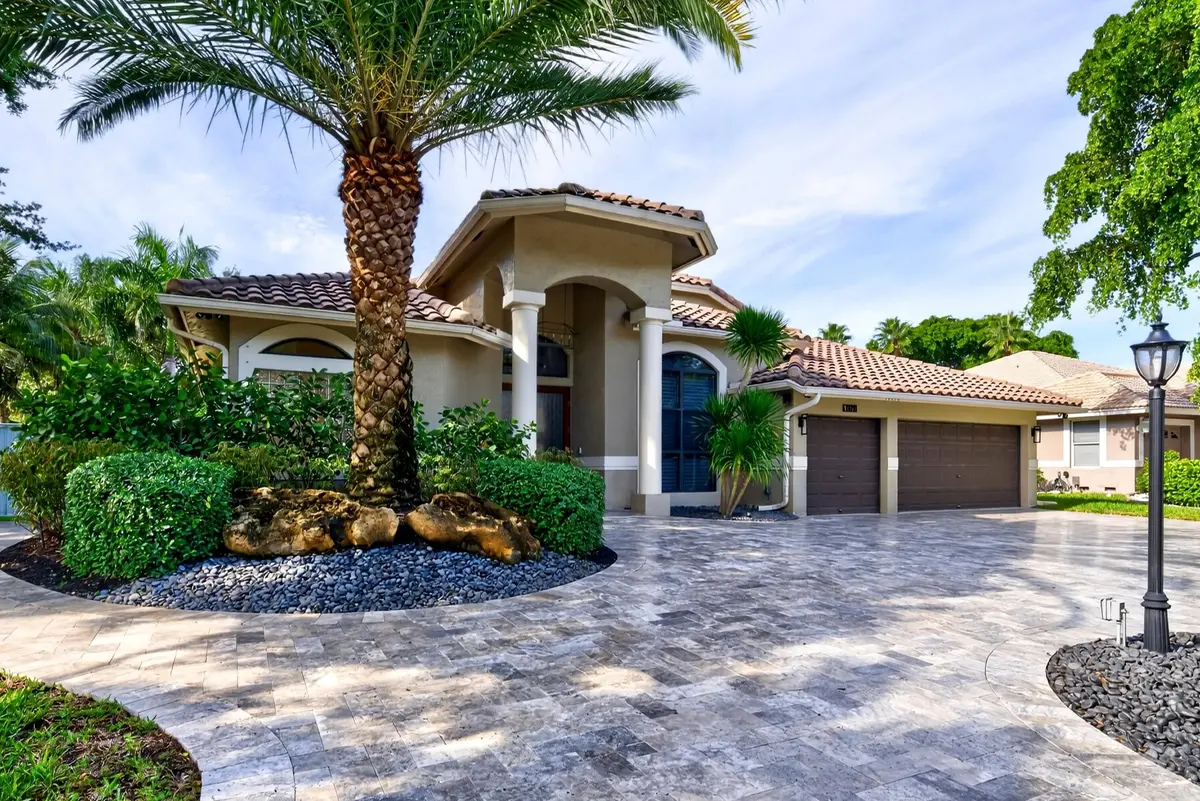 006-014-Front Exterior-4000x2671 at 10090 NW 59th Drive, Parkland