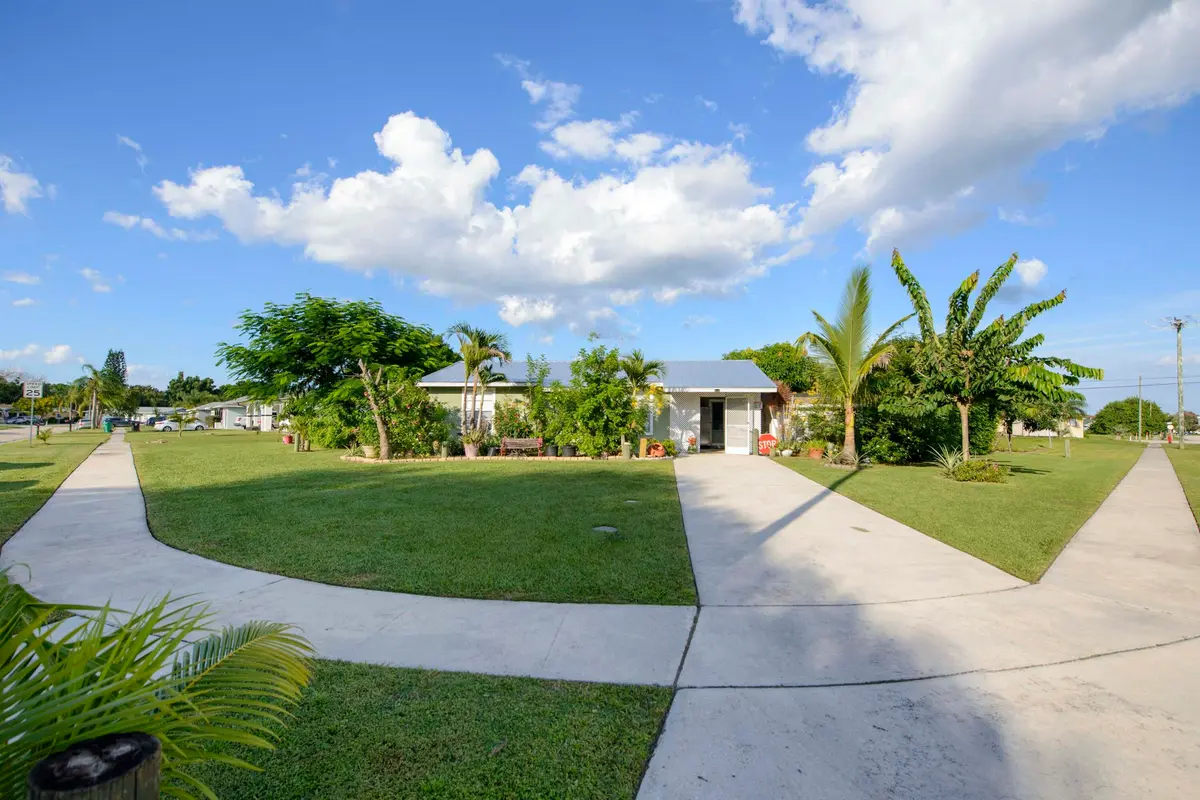 01- Front (2) at 221 SW CALMOSO Drive, Port St. Lucie