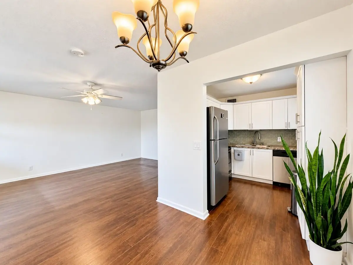 Dining to Living with Kitchen View at 200 Northampton J, West Palm Beach