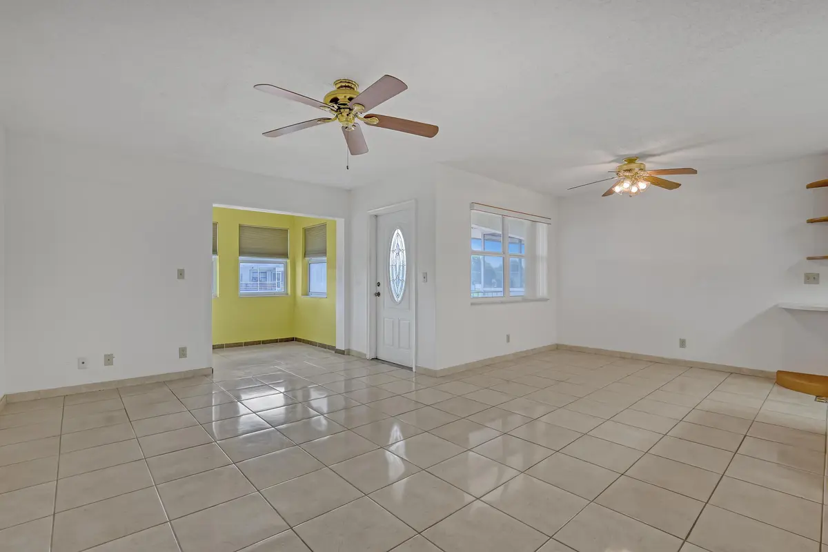 Living Room and Dining Area at 122 STRATFORD I, West Palm Beach