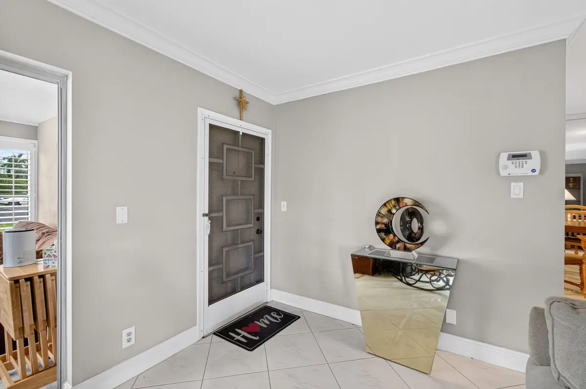 Entrance to villa interior view with scr at 4755 NW 3RD Court D, Delray Beach