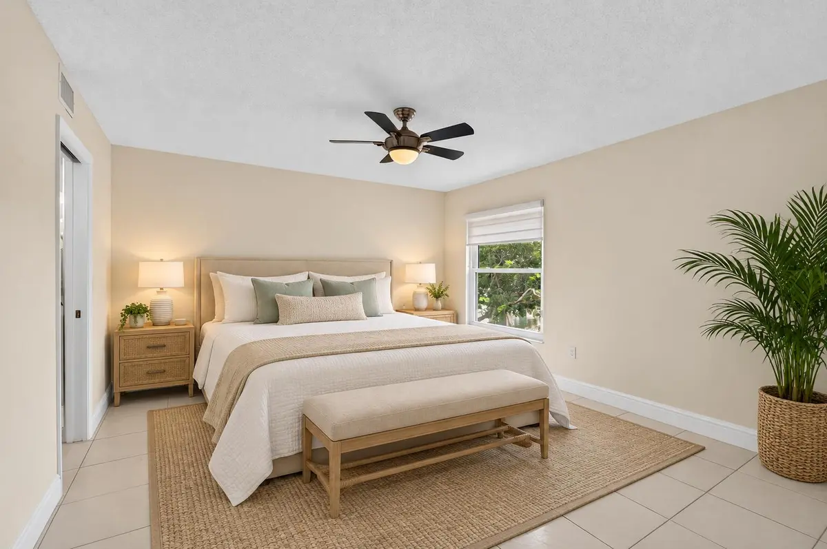 08_Primary_Bedroom_Staged at 6065 Pointe Regal Circle 403, Delray Beach