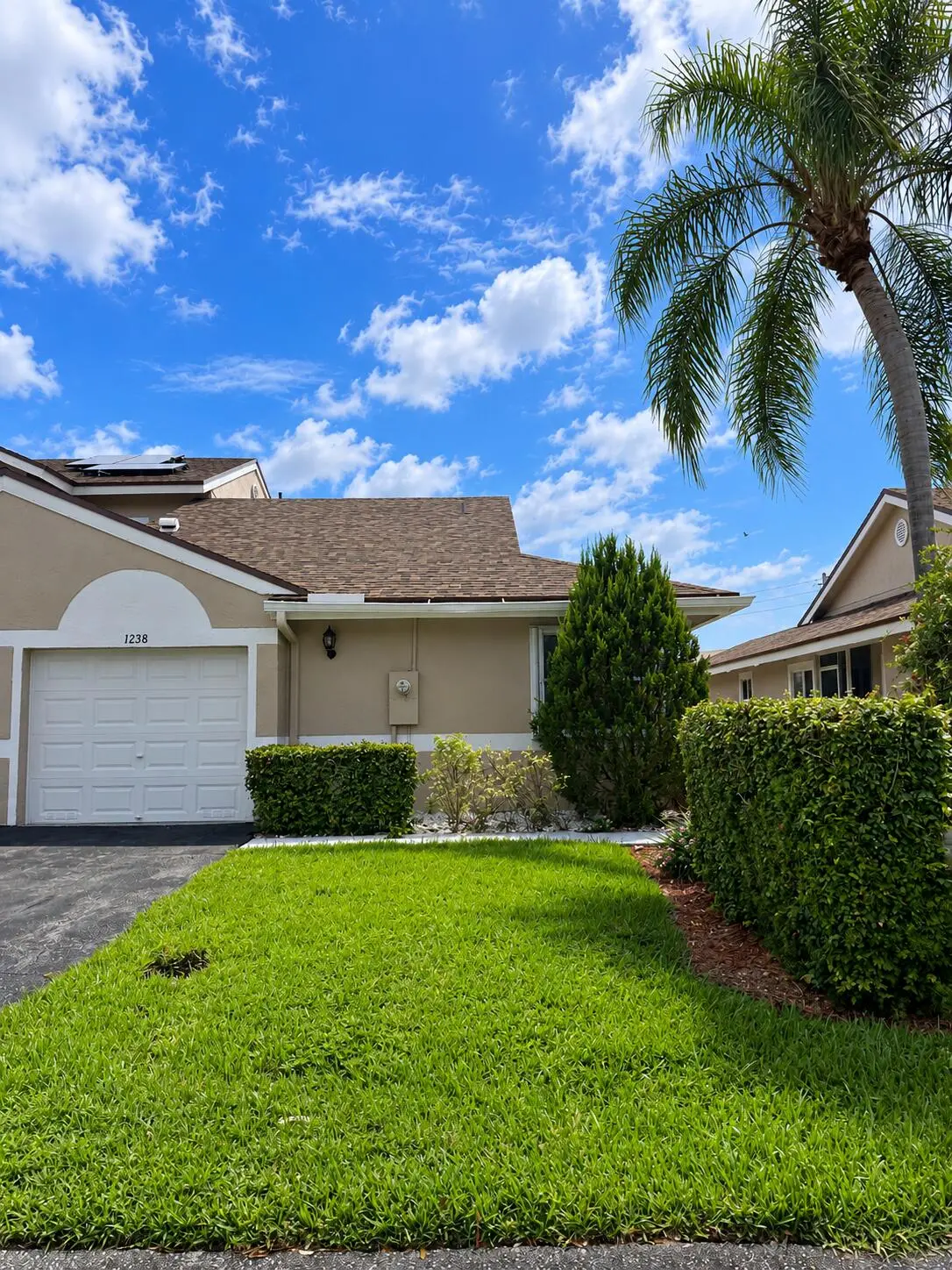 Sunny Suburban Home with Palm Trees at 1238 NW 51ST Way 1238, Deerfield Beach