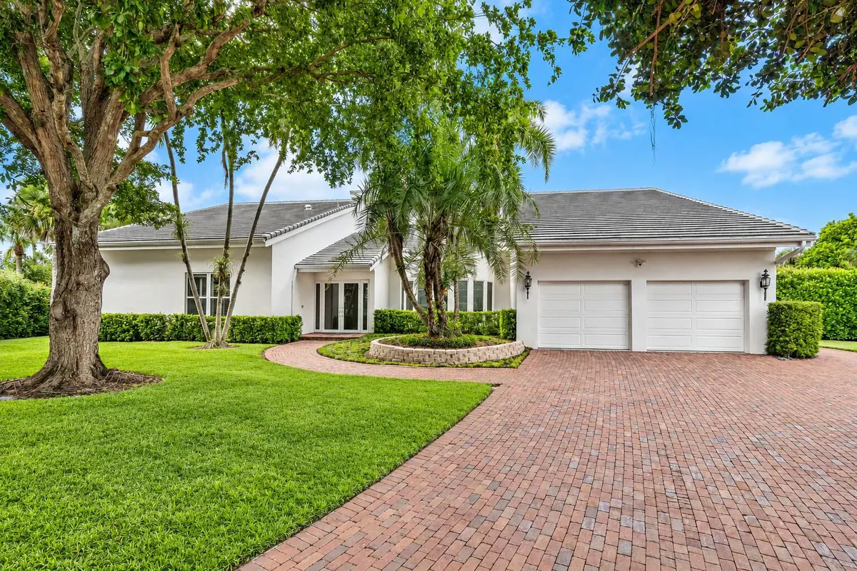 Polished Tropical Suburban Home Exterior at 4356 Kasso Circle, Boca Raton