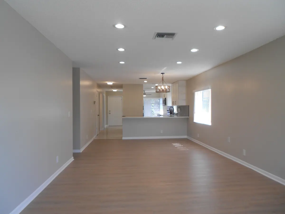 Living Area to Dining Area at 13809 Royal Palm Court B, Delray Beach