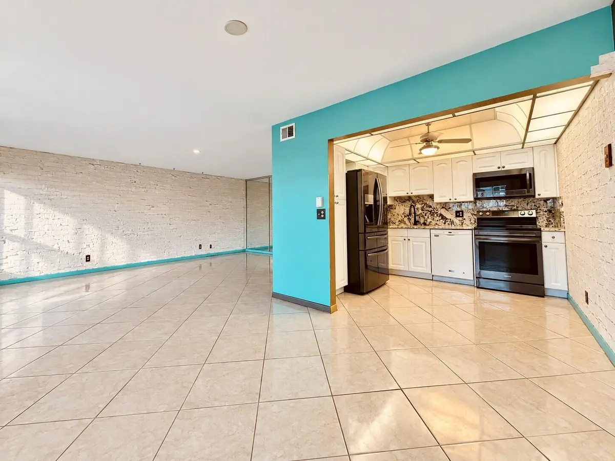Dining to Living with Kitchen at 110 WELLINGTON B, West Palm Beach