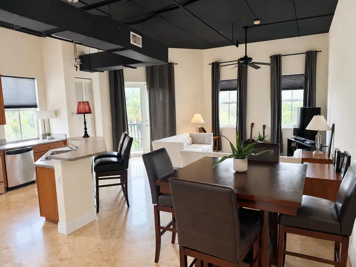Neatly staged industrial loft interior at 301 W Atlantic Avenue L10, Delray Beach