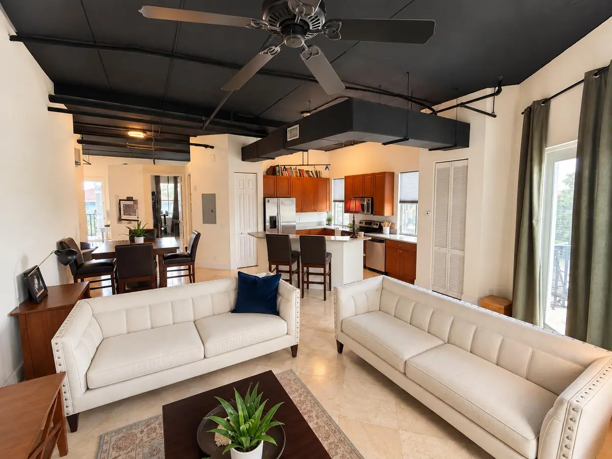 Modestly tidied real estate living room at 301 W Atlantic Avenue L10, Delray Beach
