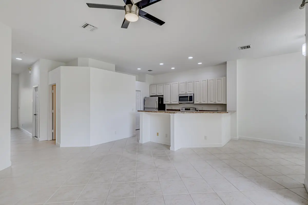 Living room - Kitchen at 402 Commons Way, Palm Beach Gardens