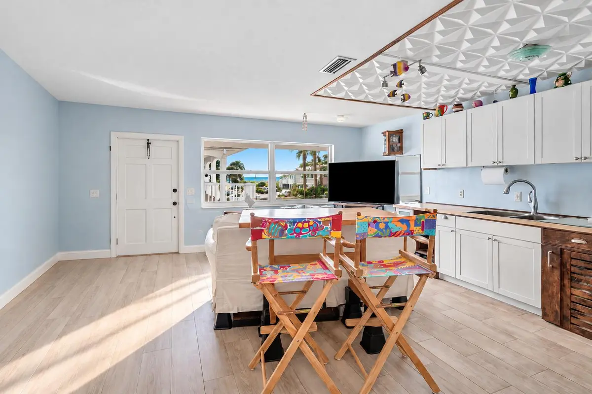 Bright Coastal Living Room with Ocean Vi at 5505 N Ocean Boulevard 11-208, Ocean Ridge