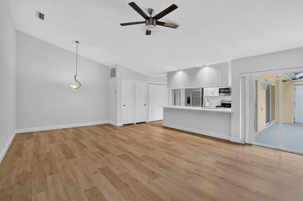 Large living and dining room at 9197 Sun Terrace Circle A, Palm Beach Gardens