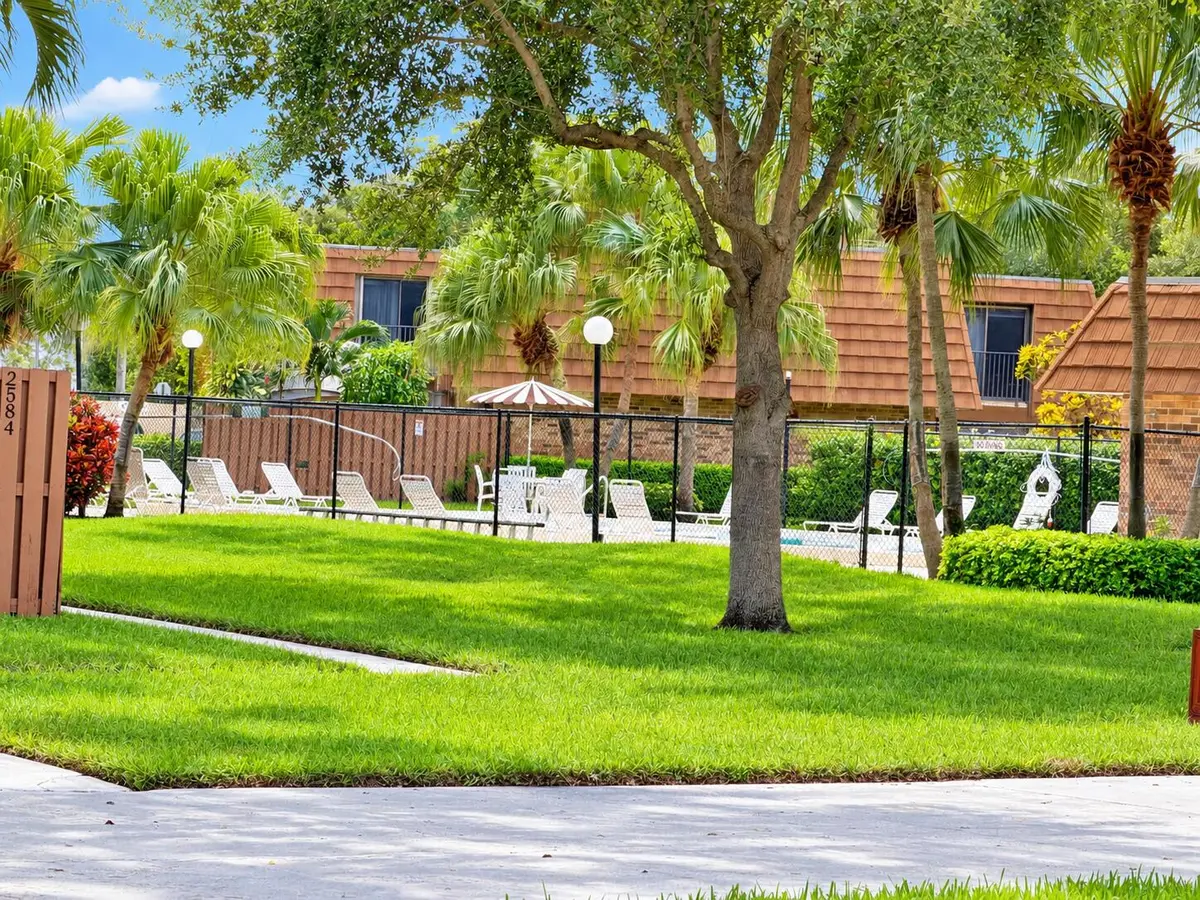 Sunny Community Pool with Tropical Lands at 2590 LAKEVIEW Court, Cooper City