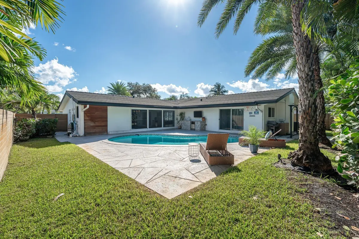 Landscaped backyard with pool at 2197 NE 61st Court, Fort Lauderdale