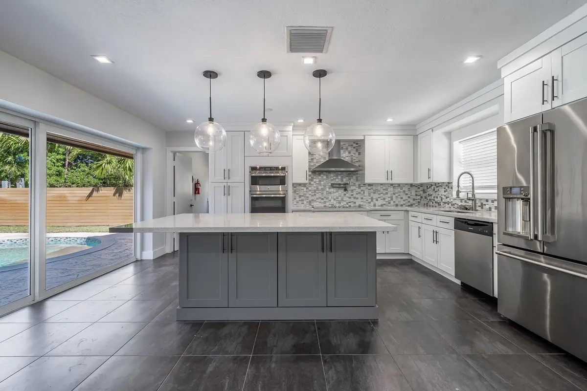 Renovated kitchen with quartz island at 2197 NE 61st Court, Fort Lauderdale