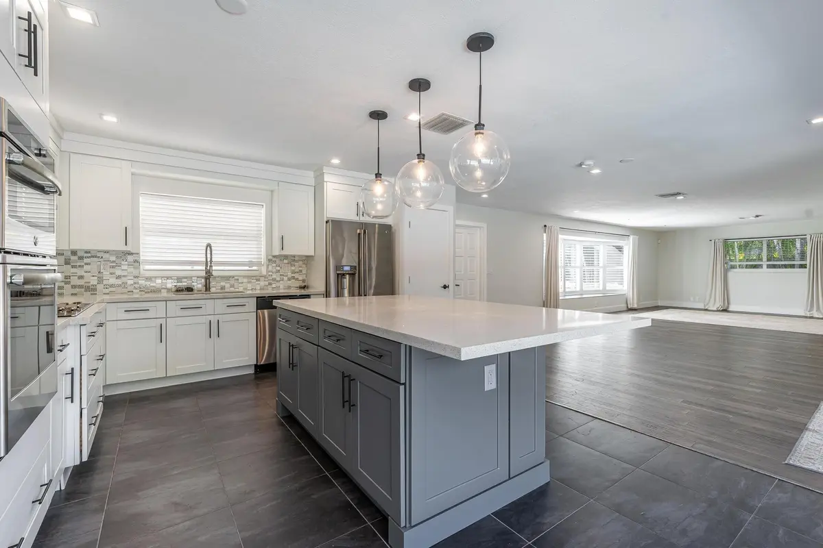 Kitchen open to living and dining at 2197 NE 61st Court, Fort Lauderdale