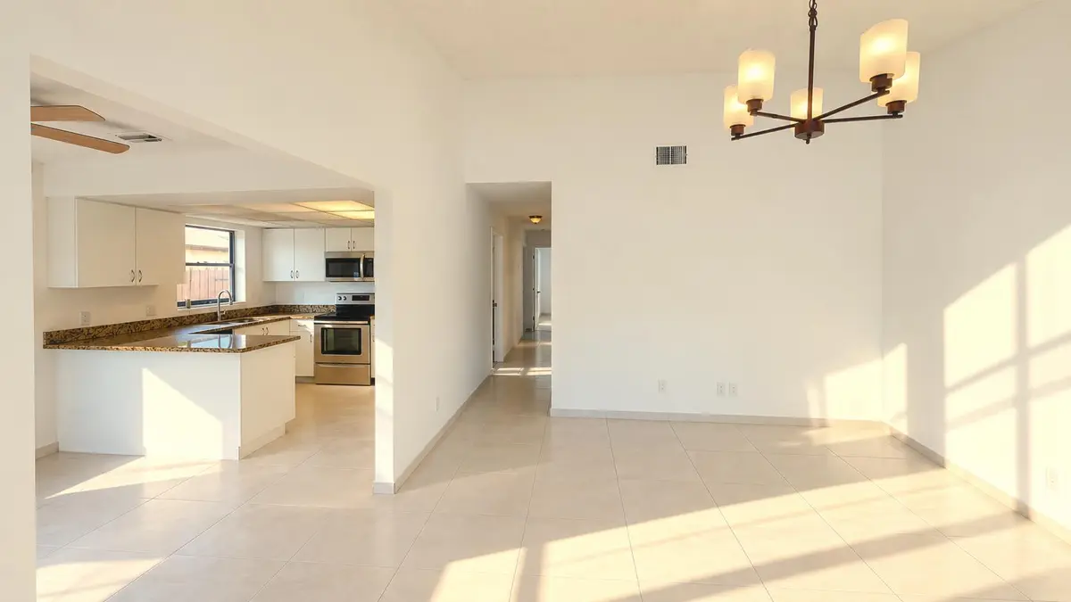 Sunlit_Minimal_Room_with_Mirrored_Closet at 3770 MIL LAKE Court, Greenacres