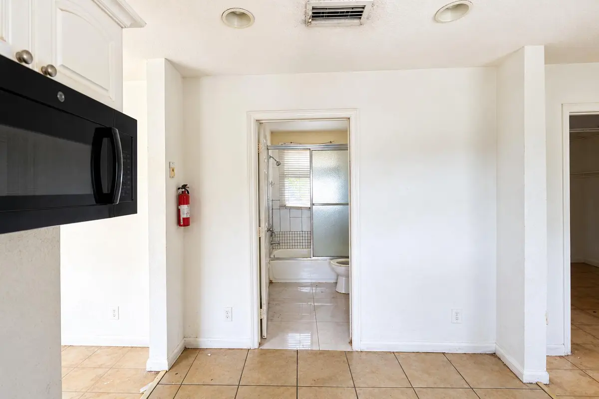 Kitchen into Bath 2 at 11 S D Street, Lake Worth Beach