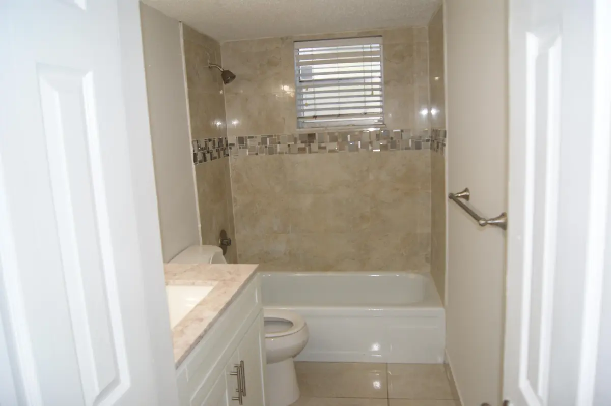CHRIS WALKER-POLYN-GUEST BTH 2 at 410 NW 68TH Avenue 119, Plantation
