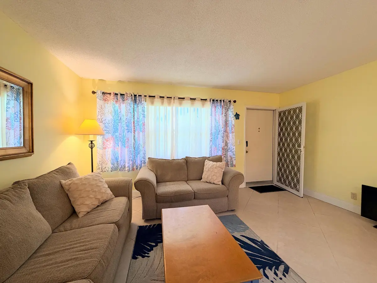 Front security screen door at 240 HORIZONS 107, Boynton Beach