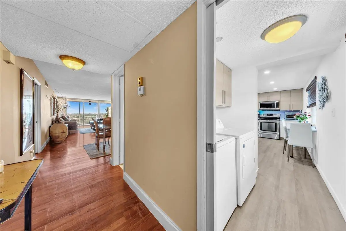 Foyer view of side by side laundry at 3520 Oaks Way 904, Pompano Beach