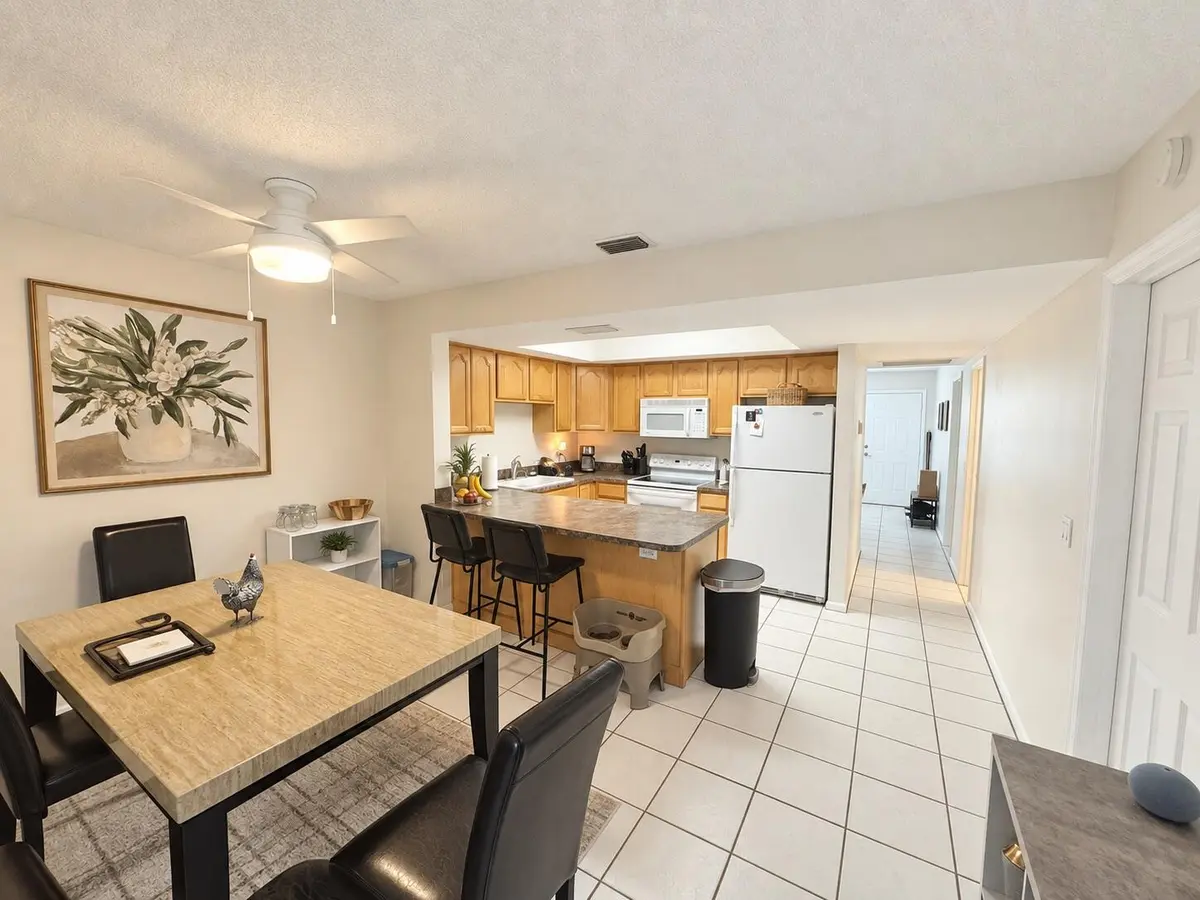 Dining Area & Kitchen at 9258 GREEN MEADOWS Way, Palm Beach Gardens