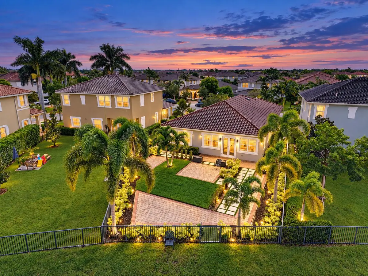 Twilight Palm-Lined Suburban Backyard at 8561 LAKESIDE Bend, Parkland