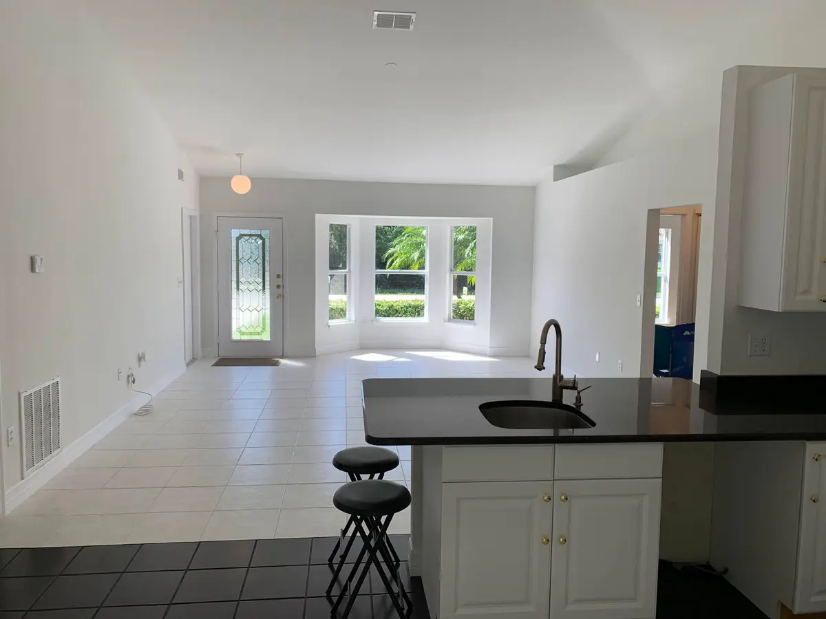 CRUZAN KITCHEN TO LIVING ROOM at 5570 NW CRUZAN Avenue, Port St. Lucie