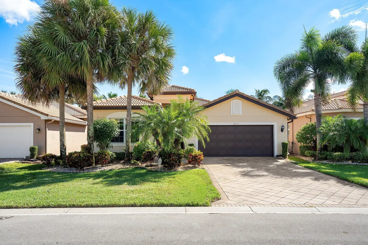 Lushly Landscaped Exterior at 8711 Sunbeam Mountain Terrace, Boynton Beach