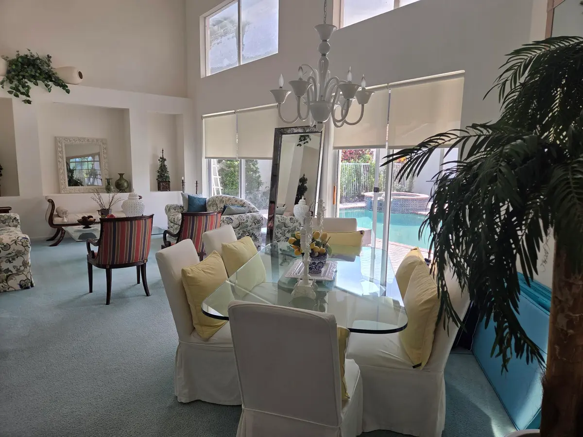 Living room and dining room with pool vi at 17275 Ventana Drive, Boca Raton