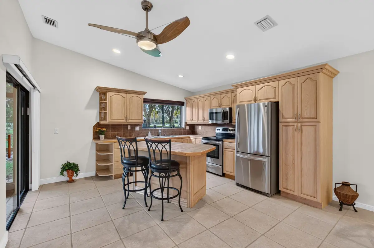 Kitchen with moveable Island at 4 Fawlkland Circle, Boynton Beach