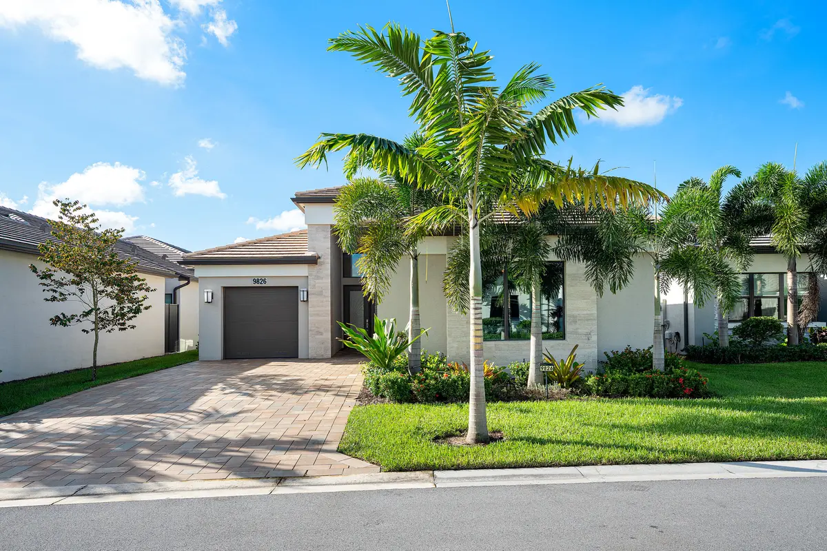 Lushly Landscaped Exterior at 9826 Turning Bluff Lane, Boynton Beach
