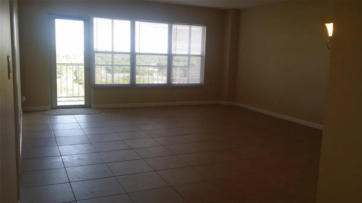 Photo 3 at 10777 W SAMPLE Road 910, Coral Springs