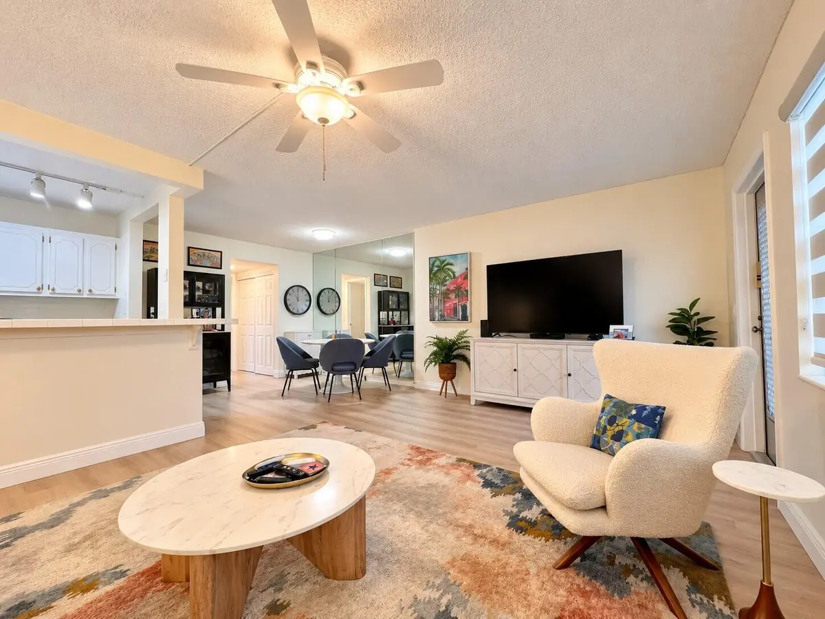 Living Area to Dining Area at 158 CHATHAM H, West Palm Beach