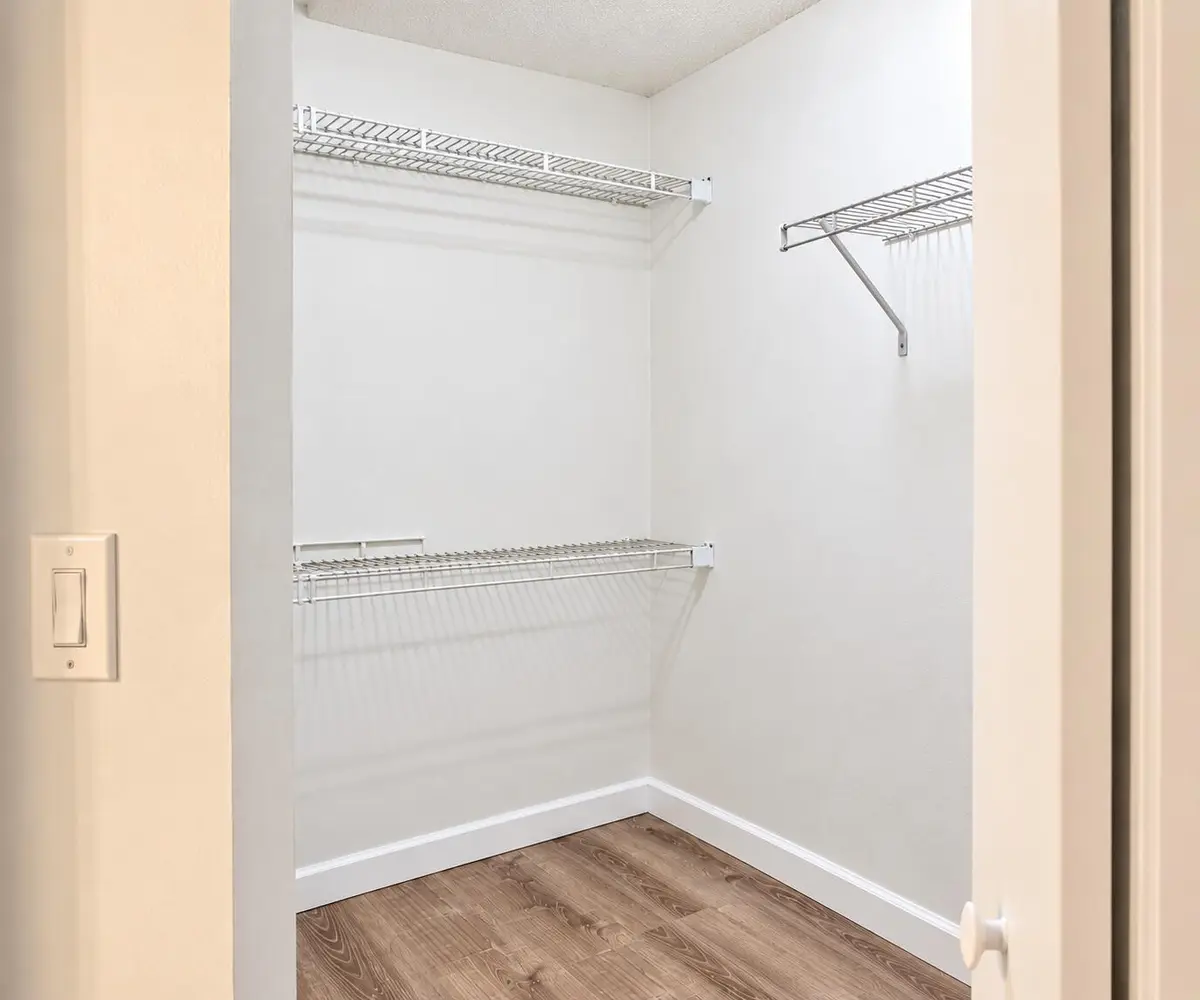 Bright Empty Walk-In Closet Shelving at 4450 NW 30TH Street 111, Coconut Creek